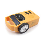 Hand-cranked radio emergency light